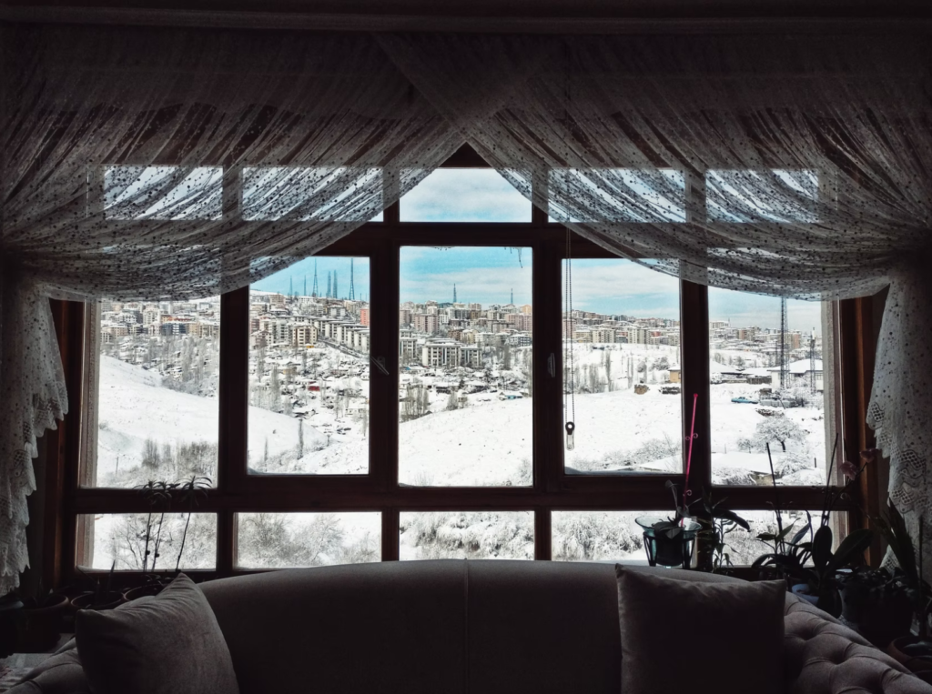 Window overlooking the city in winter