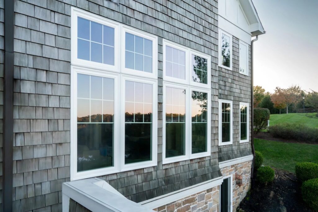 vytex windows installed onto a house with gray shingle siding