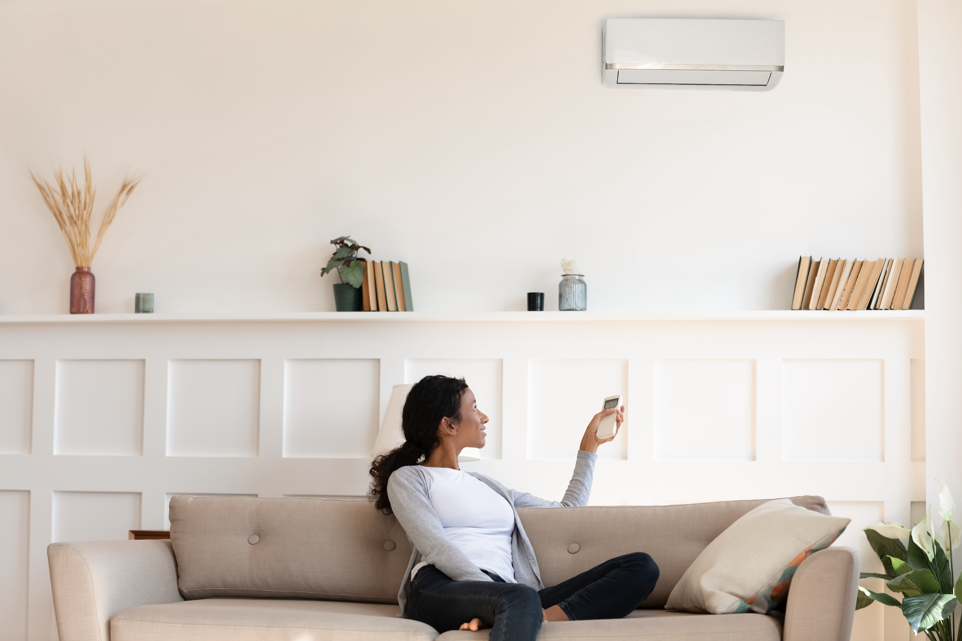 women heating home during the winter with a heat pump mini split
