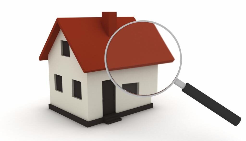 house with a magnifying glass hovering over