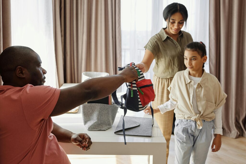parents getting their child ready for school