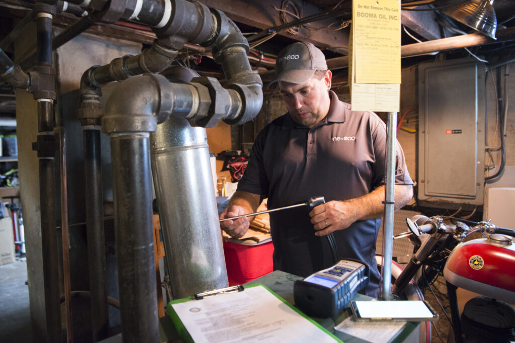 Neeeco auditor conducting a combustion safety test