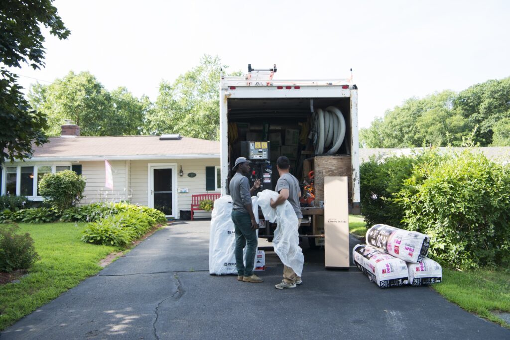 neeeco team getting ready for a insulation job pulling equipment out of truck